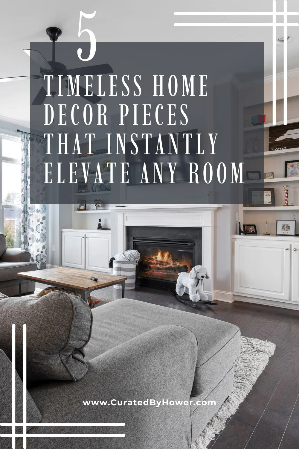 Elegant living room with gray sofa, fireplace, and built-in shelving showcasing timeless home decor pieces