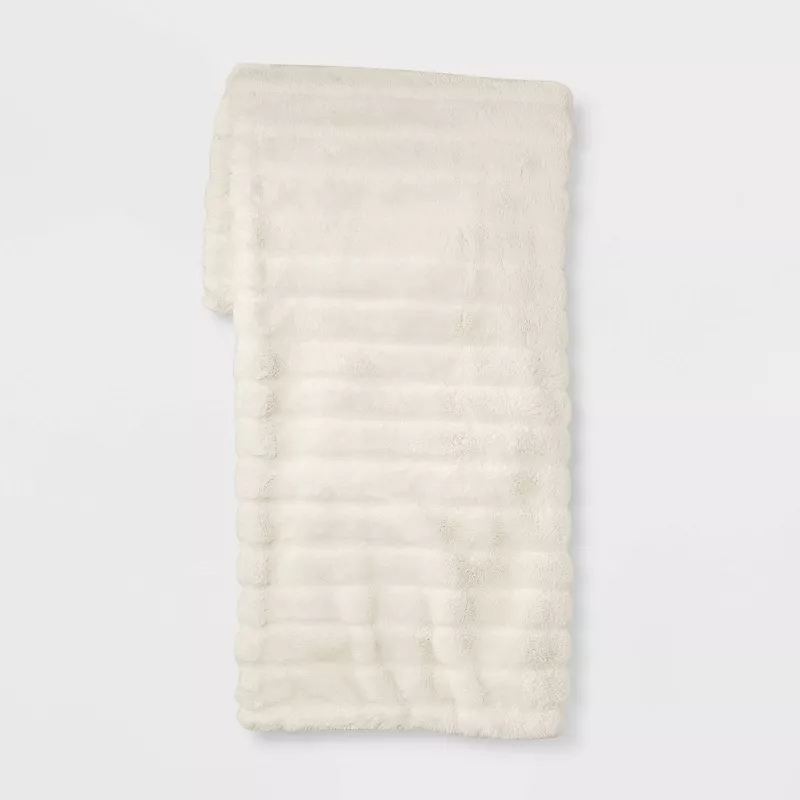 Textured faux fur reversible throw blanket in cream white with soft plush fabric