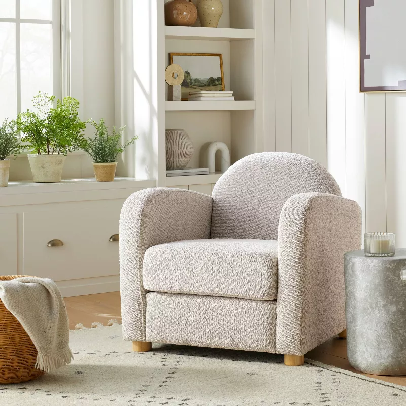 Pacific Palisades beige boucle accent chair in modern farmhouse living room with white shiplap walls