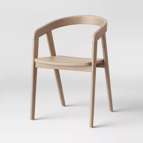 Modern wooden dining chair with curved backrest and armrests in natural light finish