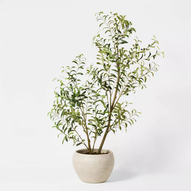 Faux eucalyptus tree in cream pot from Target with realistic green and white variegated leaves