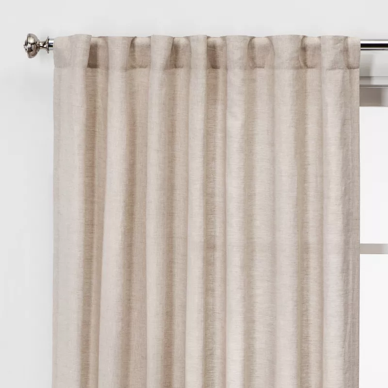 Light filtering linen window curtain panel in cream color hanging on decorative rod, 54x84 inches
