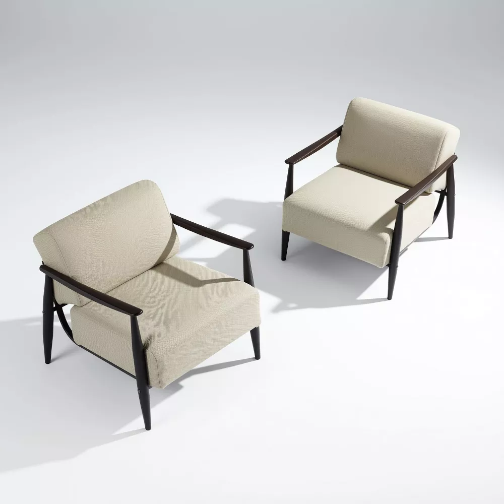 Mid-century modern accent chairs with cream upholstery and dark wood frames in minimalist setting