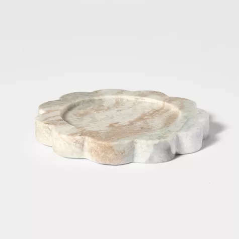 Marble candle tray in gray and white swirled stone with scalloped edges on white background
