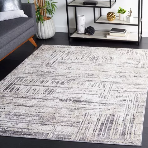 Opal OAL420 gray and white geometric power loomed area rug displayed in modern bedroom setting