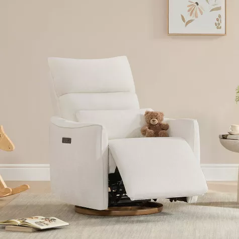White nursery glider chair with ottoman in modern nursery room with teddy bear and neutral decor