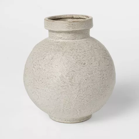Round textured ceramic vase with speckled white glaze and narrow neck opening