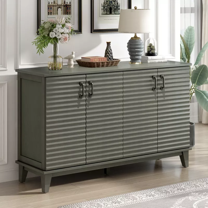 Gray ribbed sideboard cabinet with decorative vases and plants in modern dining room interior