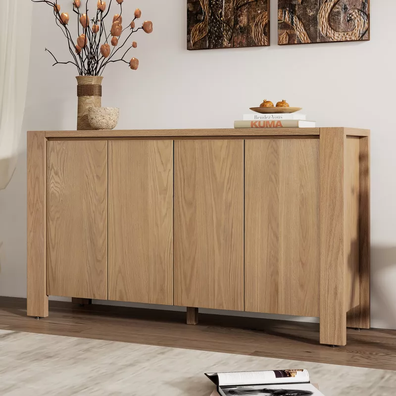 Modern oak sideboard with four doors in living room with decorative wall art and home accessories