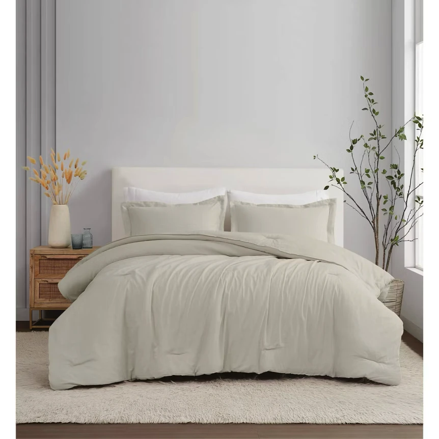 Neutral beige linen bedding set on bed with minimalist bedroom decor and natural wood nightstand