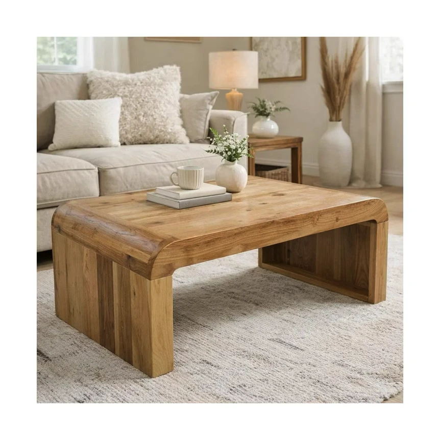 Rustic wooden coffee table with chunky legs in neutral living room with beige sofa and decorative pillows
