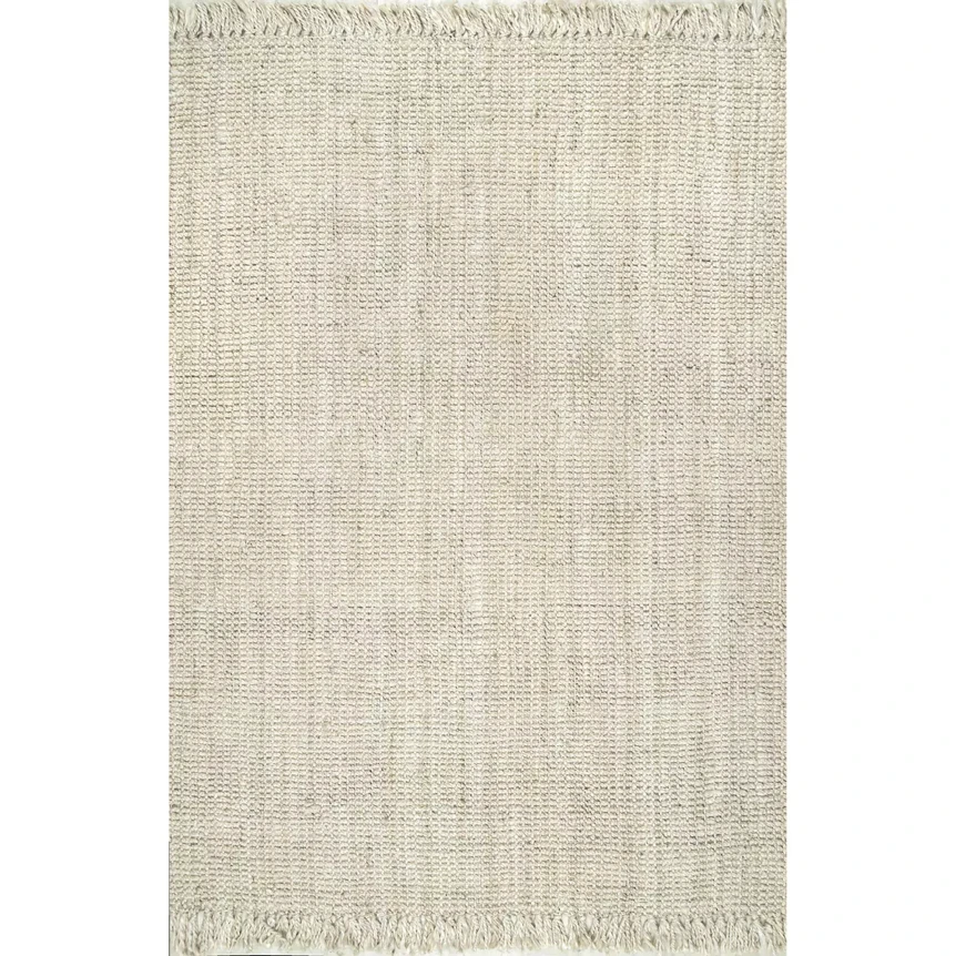 Handwoven neutral jute area rug with fringe tassels in cream and beige tones