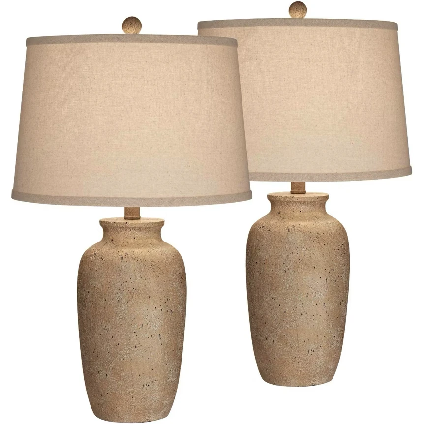 Set of two beige textured ceramic table lamps with neutral tapered drum shades for bedroom decor