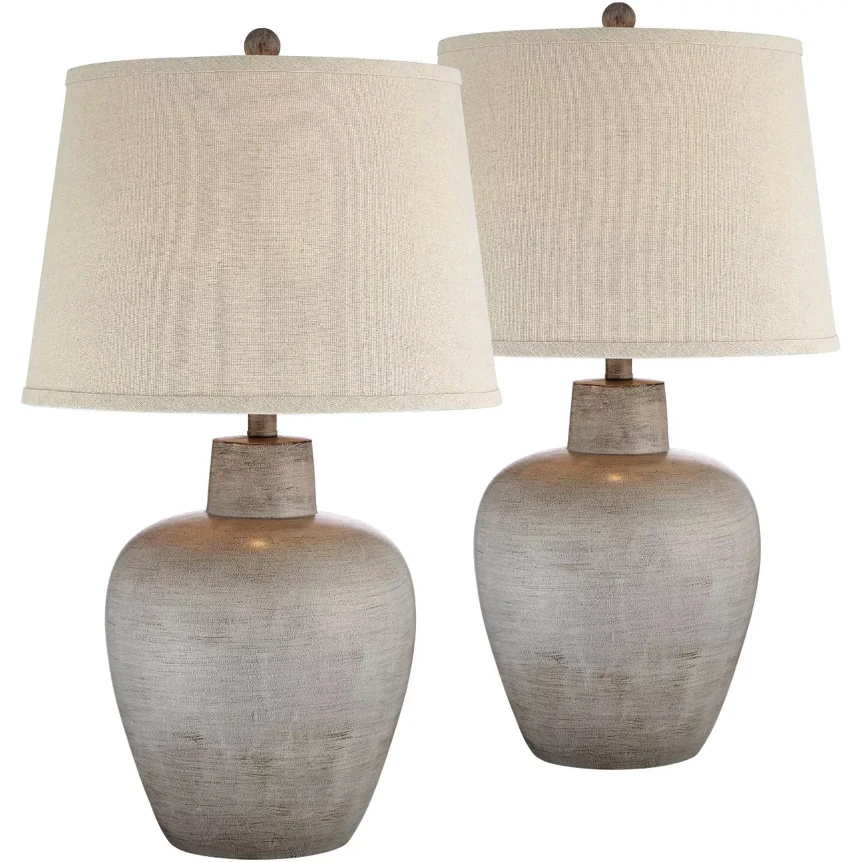 Set of two textured ceramic table lamps with neutral linen drum shades for classic living room decor