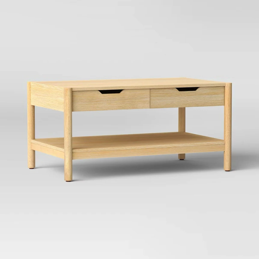 Natural wood Scandinavian coffee table with two drawers and lower shelf on light background