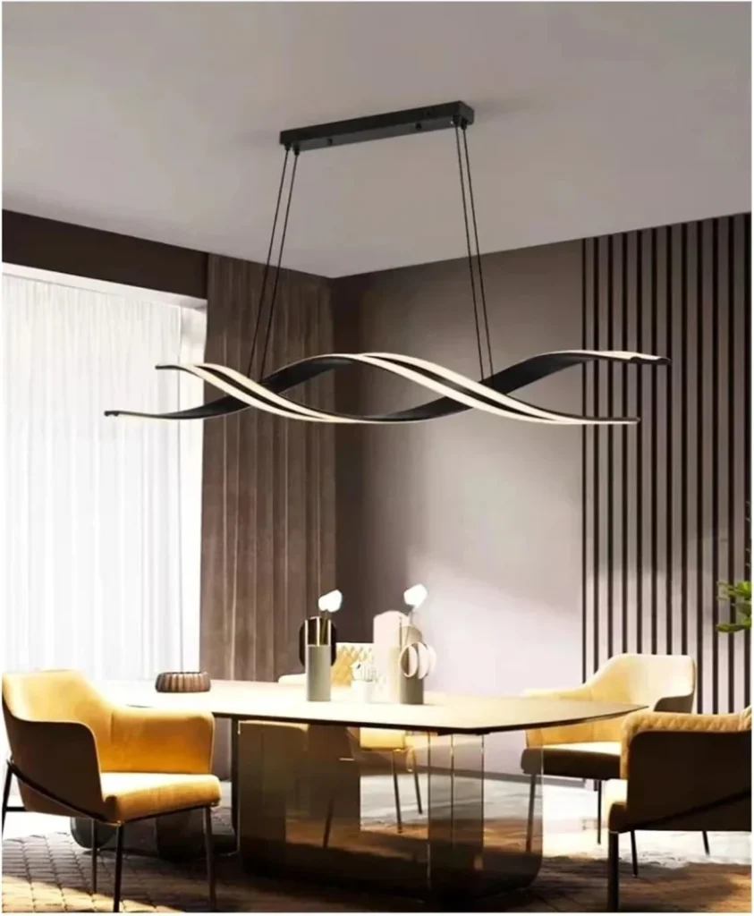 Modern wave chandelier above dining table with brown chairs and yellow accents in contemporary dining room