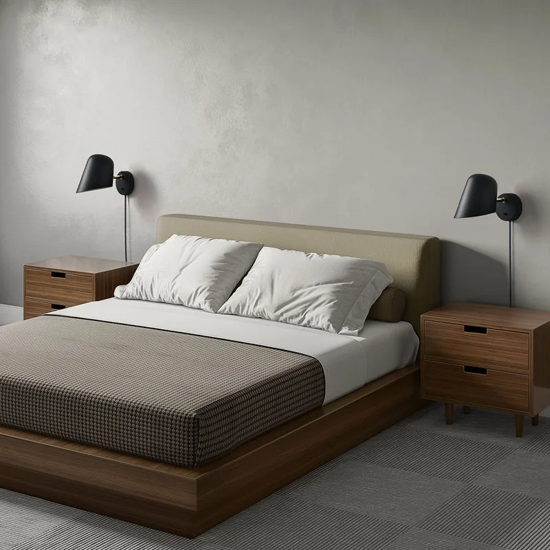 Modern bedroom with platform bed, wooden nightstands, black wall sconces, and minimalist gray decor