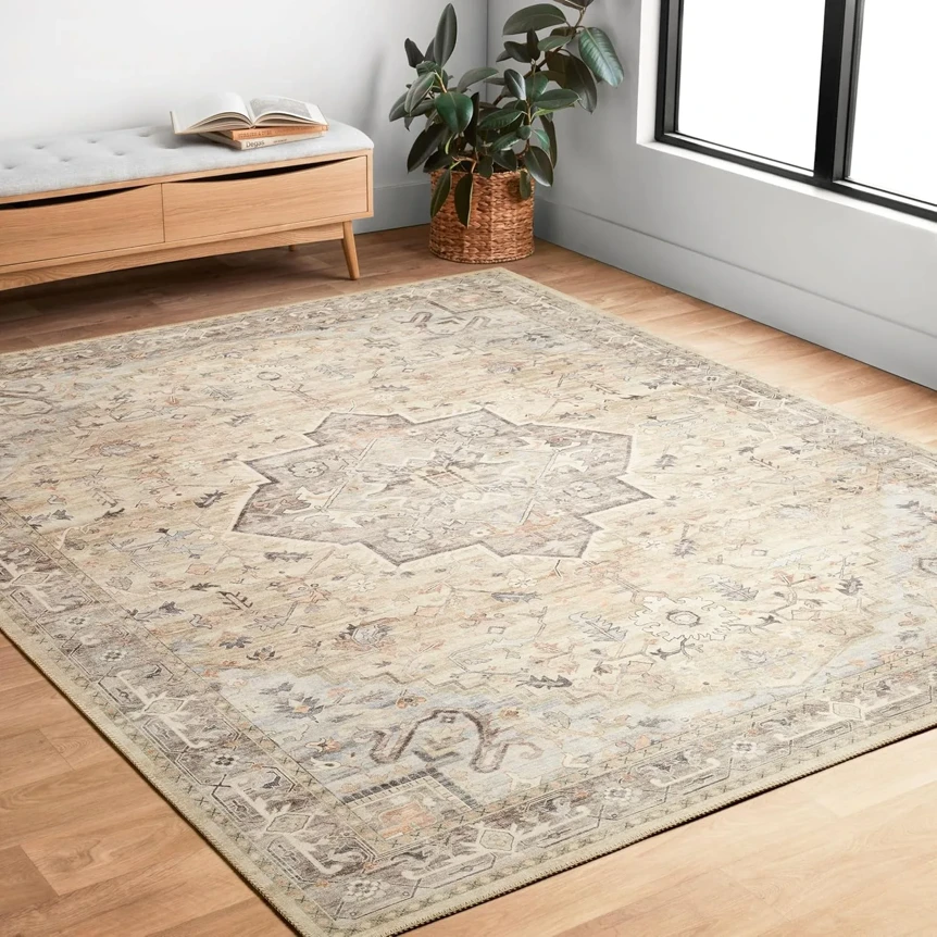 Beige and gray vintage-style area rug in modern bedroom with wooden furniture and natural light