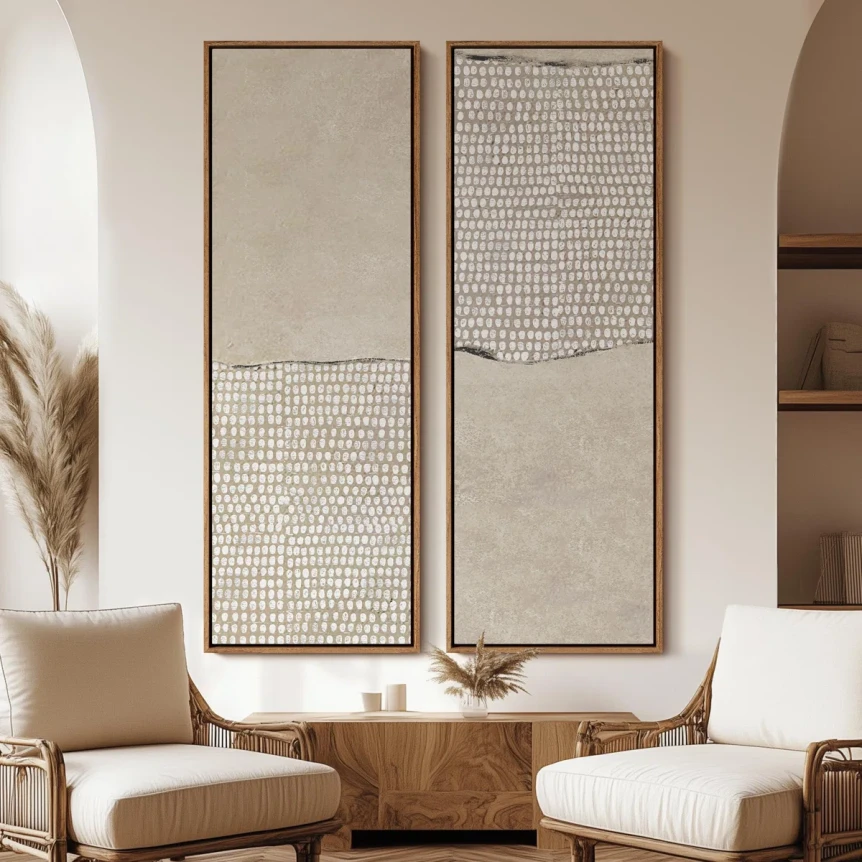 Two abstract framed wall art panels with neutral tones and textured patterns above a wooden console in modern living room