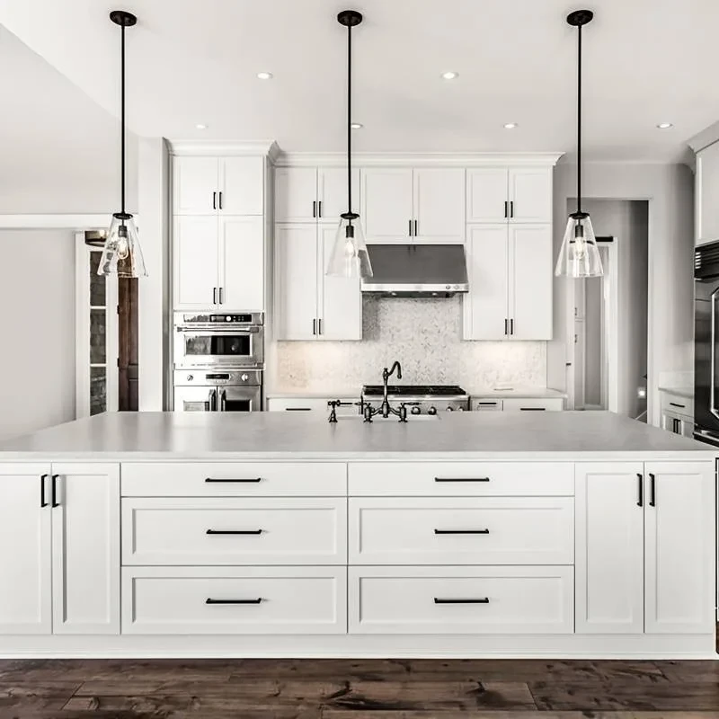 close-up of matte black bar pulls on white shaker kitchen cabinets