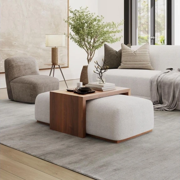 Modern living room with wooden side table beige pouf ottoman and minimalist furniture arrangement