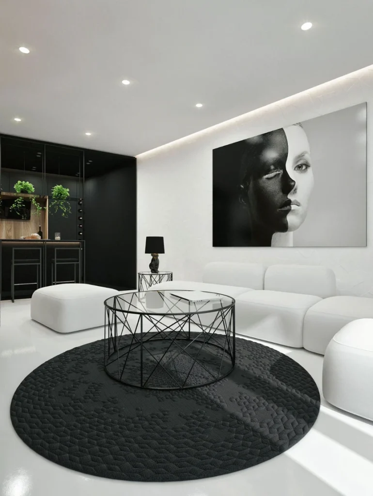 Modern monochrome living room with white sofa black round rug geometric coffee table and striking portrait art