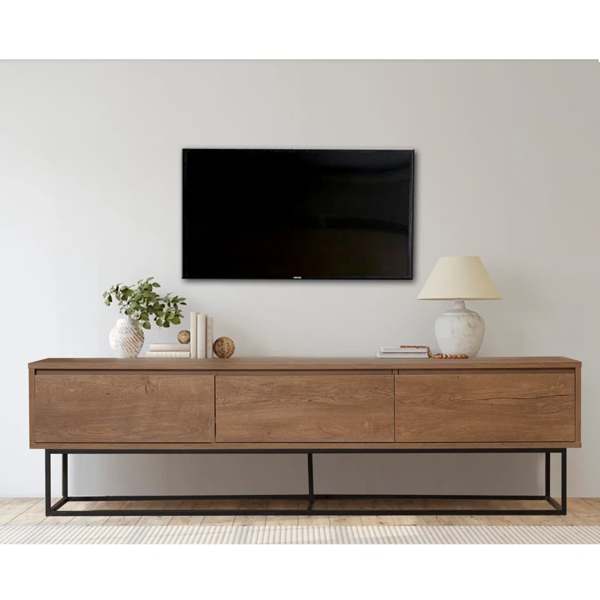 Modern wood TV stand with metal legs beneath wall mounted television in minimalist living room
