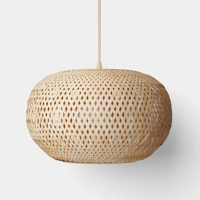 Bamboo woven pendant light with round dome shape and natural finish hanging from ceiling cord