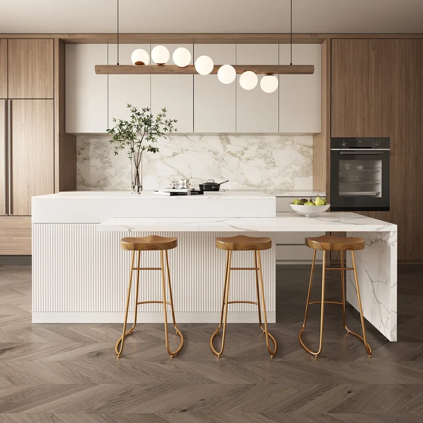 Modern kitchen with white marble island, wooden bar stools, and minimalist pendant lighting in neutral tones