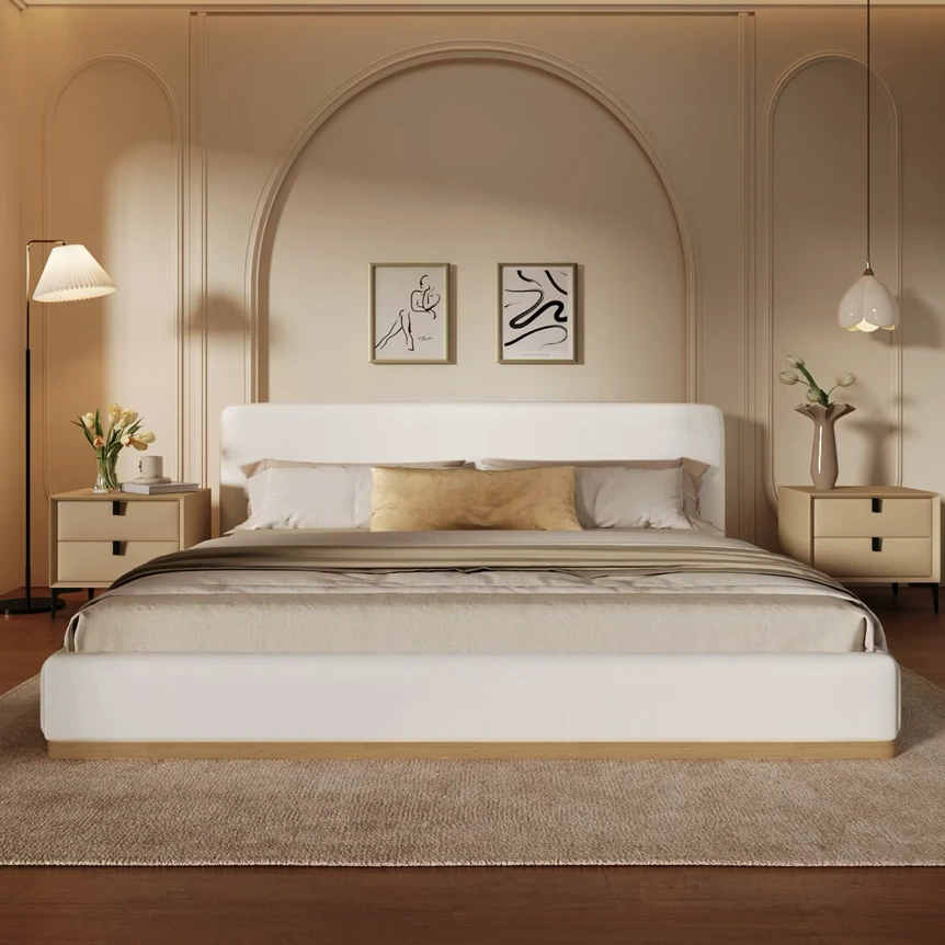 Modern bedroom with white platform bed, beige accent wall with arch detail, matching nightstands and warm neutral tones