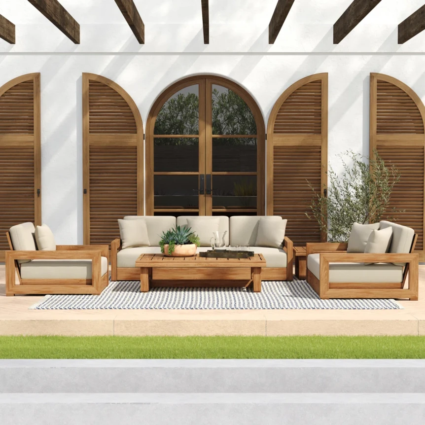 Mediterranean patio with teak furniture, white cushions, arched shutters, exposed wooden beams, and striped outdoor rug