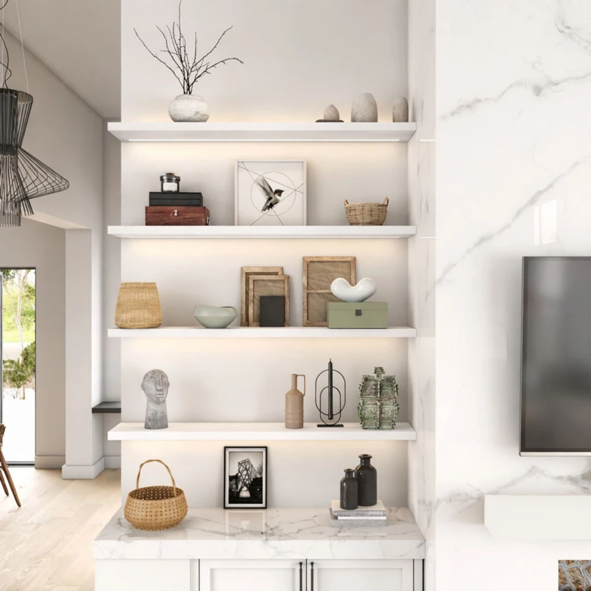 Modern white floating shelves with minimalist decor and artwork in bright living room
