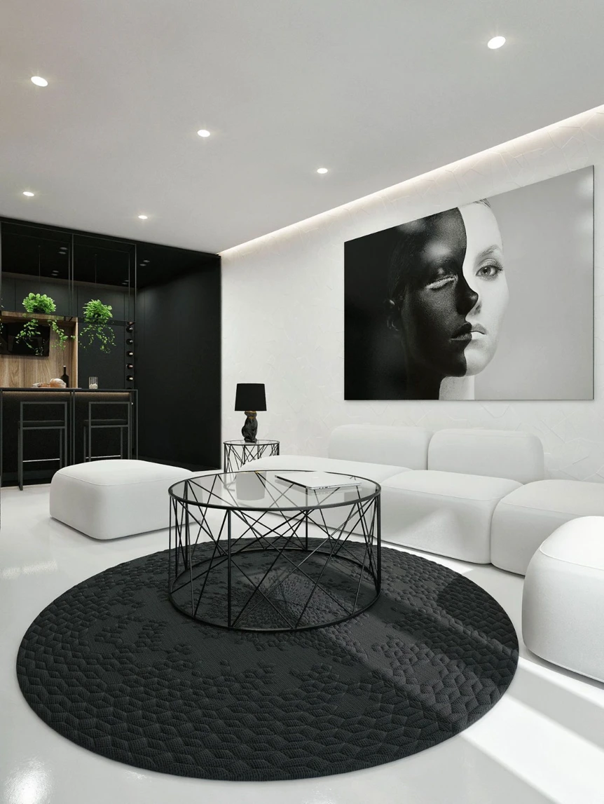 Modern monochrome living room with white sofa, black round rug, geometric coffee table, and striking portrait art