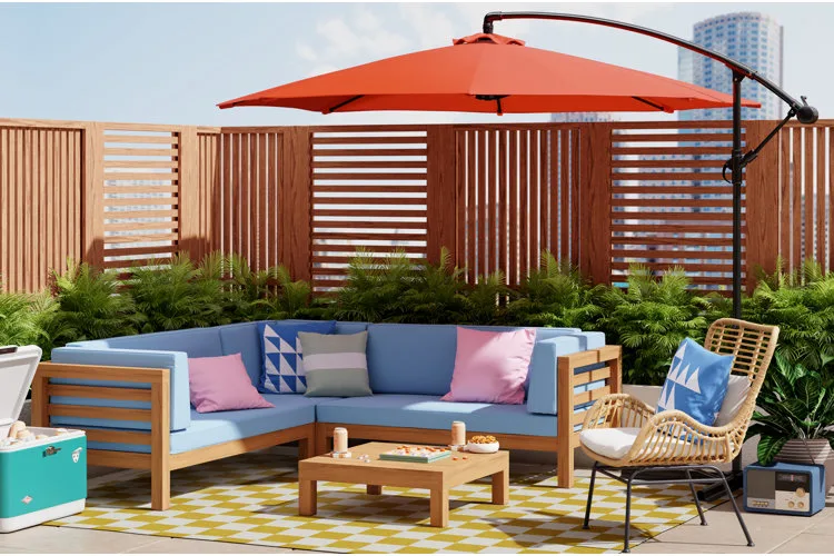 Small patio with a red arched umbrella over a seating area