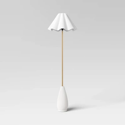 Wavy Shade Collection Ceramic Base Floor Lamp with white pleated shade and wooden pole on neutral background