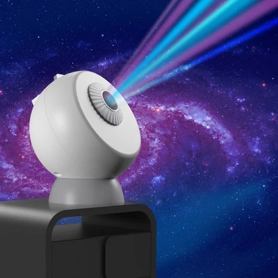 West & Arrow white spherical planetarium projector displaying colorful nebula stars on wall with galaxy background