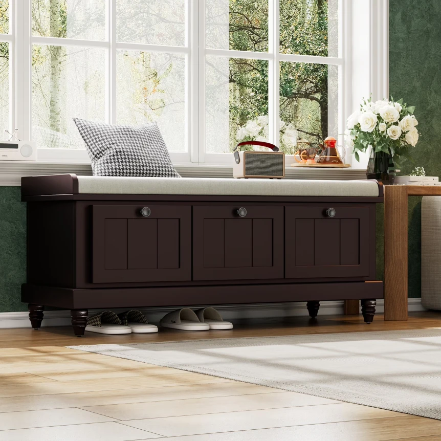 Dark wood storage bench with drawers and cushioned seat by sunny window in bright room