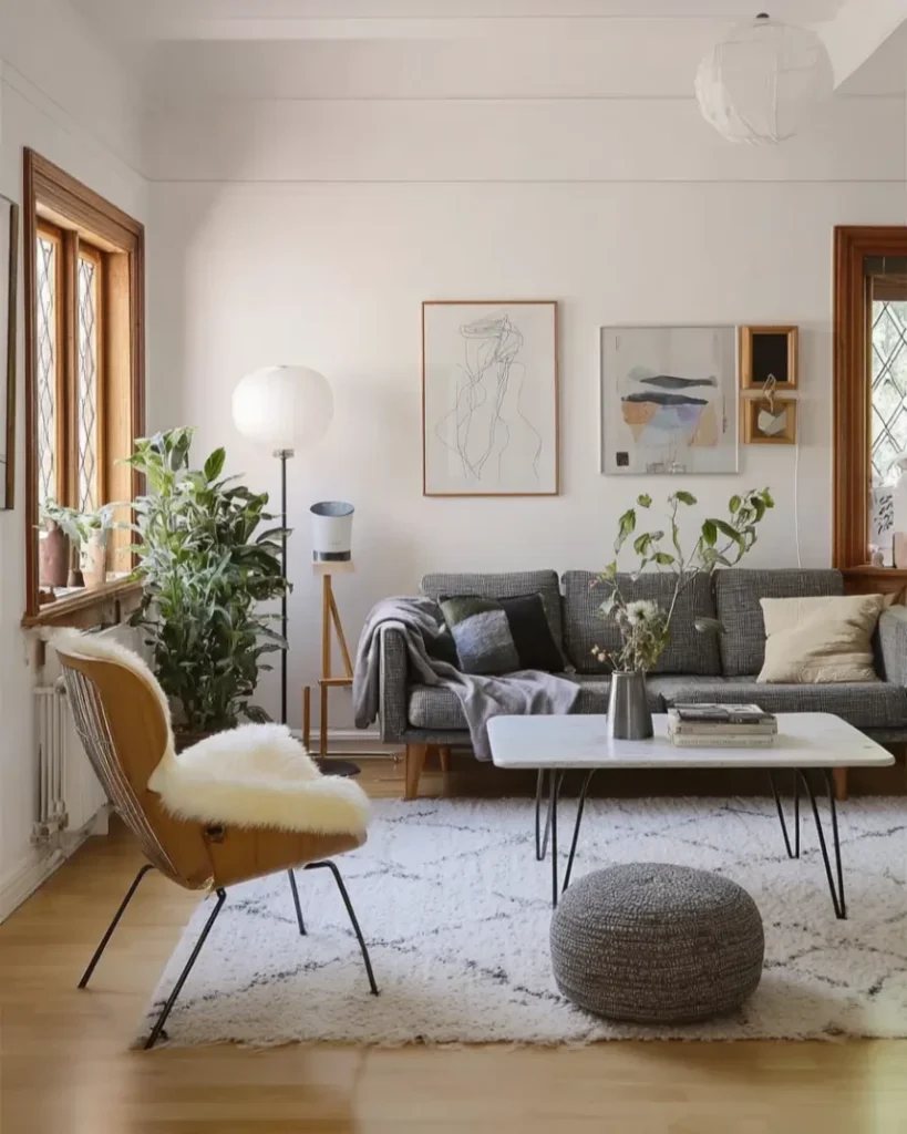 Mid century modern Scandinavian living room with light wood sofa and gallery wall