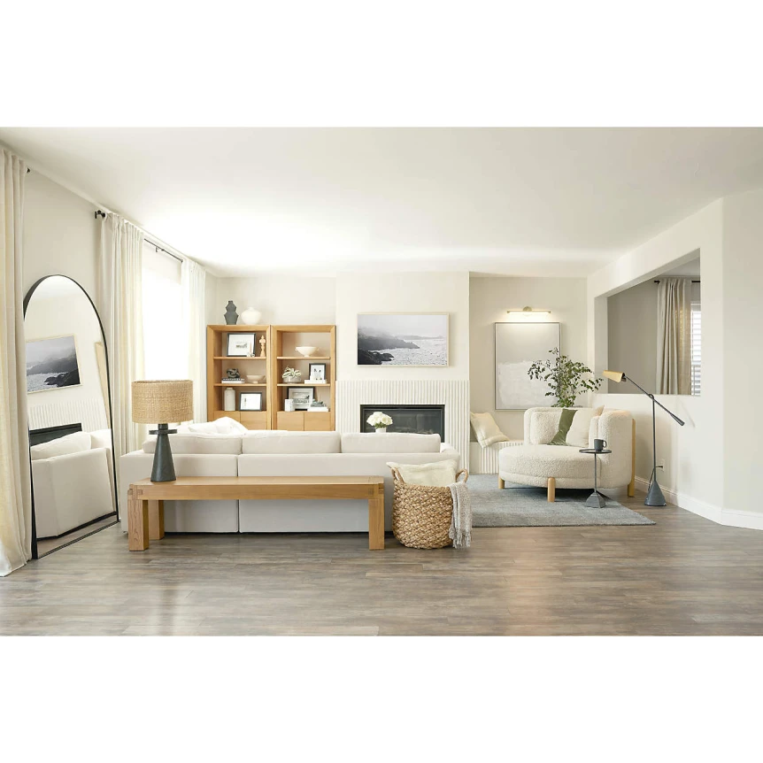 Minimalist living room with light wood furniture, neutral tones, and modern decor creating timeless elegant space