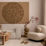 Modern Japandi living room with curved sofa, wooden coffee table, and natural woven wall art in neutral tones
