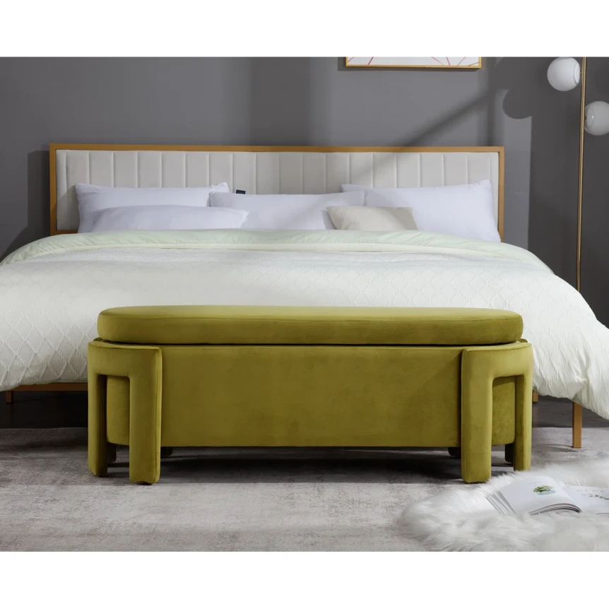 Modern chartreuse velvet storage bench with geometric design at foot of white bedding in contemporary gray bedroom