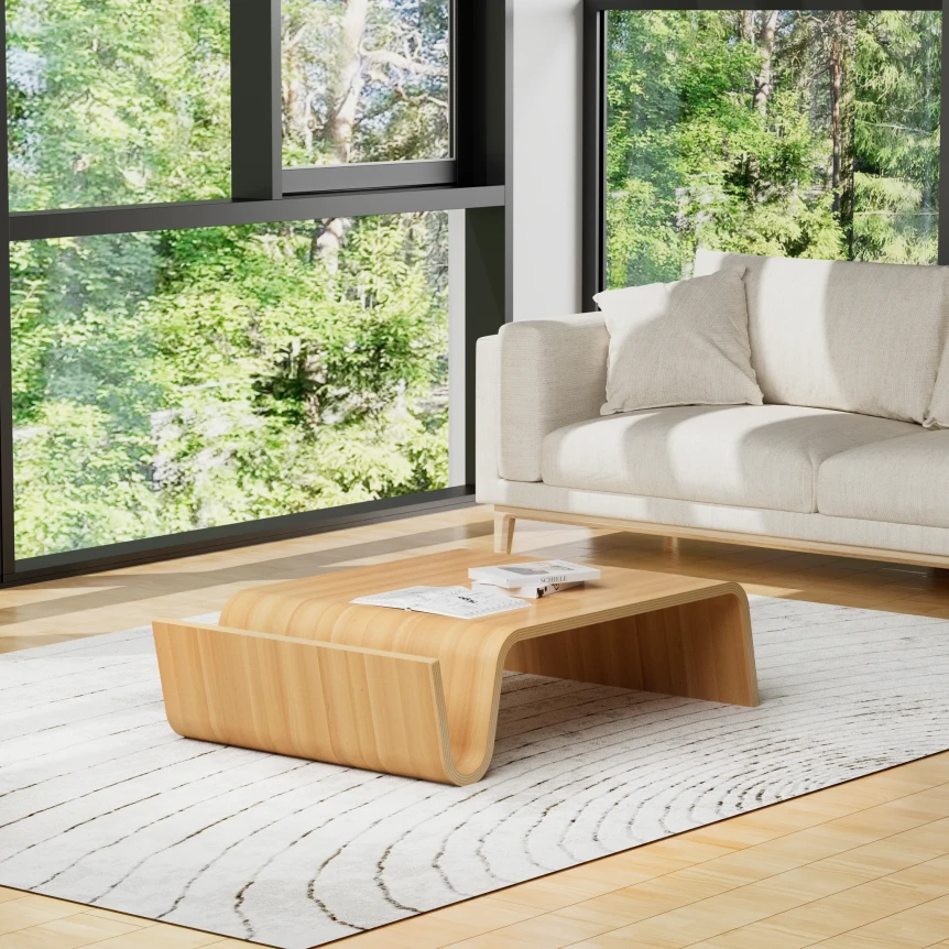 Light oak Scandinavian coffee table styled with books and ceramic vase
