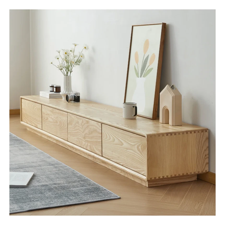 Modern light wood TV stand with four drawers and minimalist decor in contemporary living room