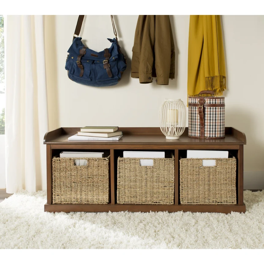 Modern storage bench with three woven baskets in dark wood finish below coat hooks in entryway