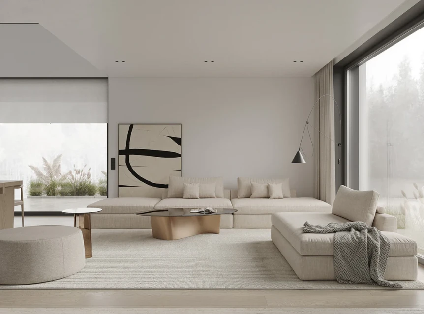 Minimalist living room with neutral tones, low wooden furniture, sectional sofa, and abundant natural light