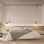 Minimalist bedroom with low platform bed, neutral tones, pendant lights, and clean concrete ceiling