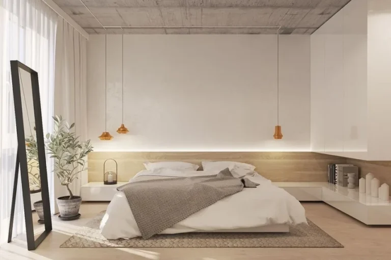 Minimalist bedroom with low platform bed, neutral tones, pendant lights, and clean concrete ceiling