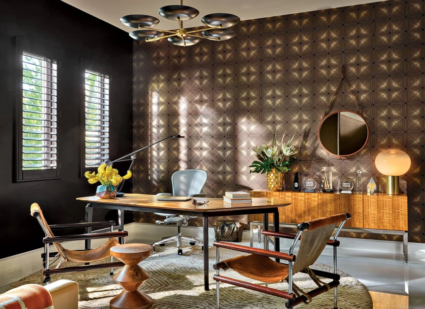 Midcentury inspired office with a desk at its center and a wooden cabinet resting on the back wall