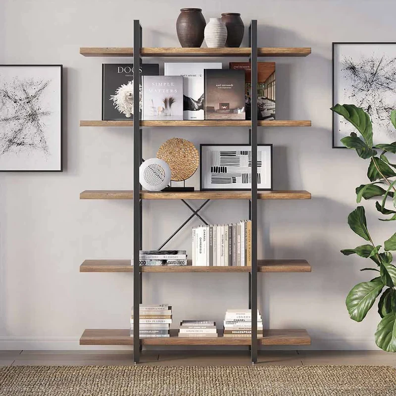 Industrial bookshelf with wood shelves and metal frame displaying books, decor, and plants against white wall