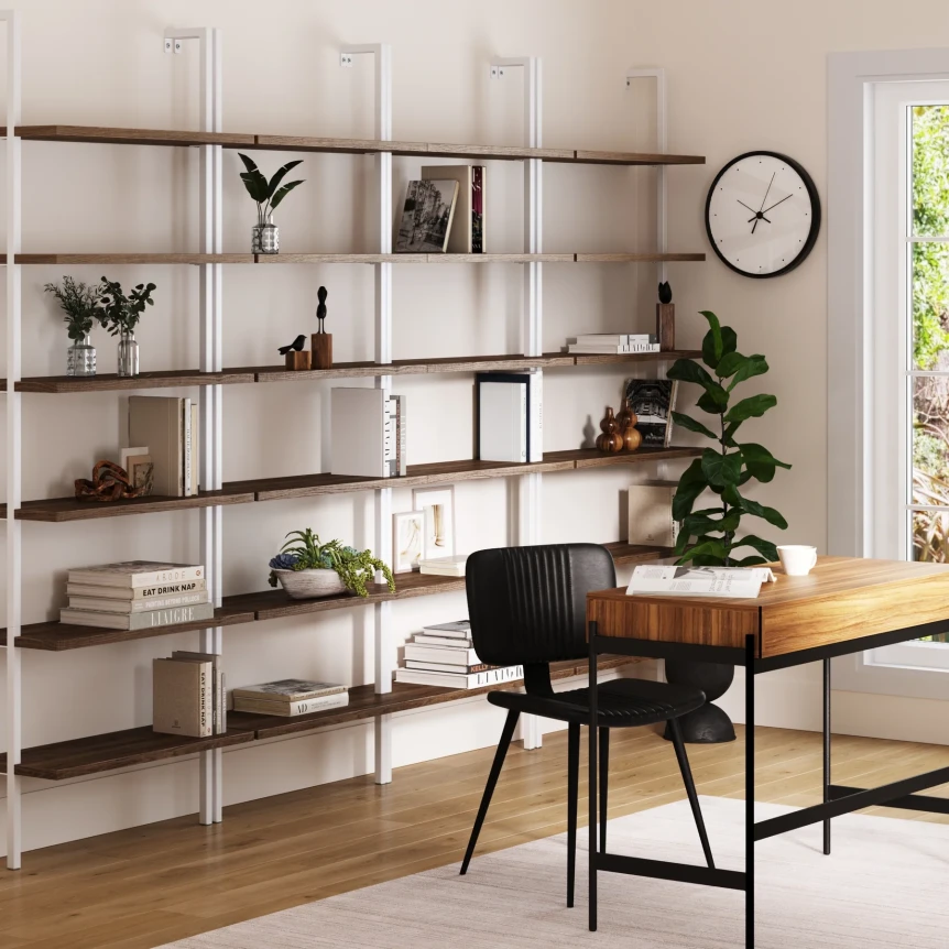 Modern freestanding bookshelf with wooden desk and black chair in minimalist home office workspace